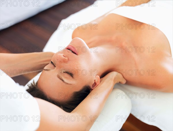 Woman receiving massage in spa