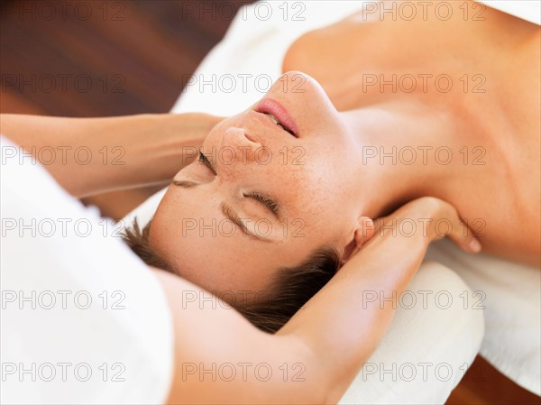 Woman receiving massage in spa