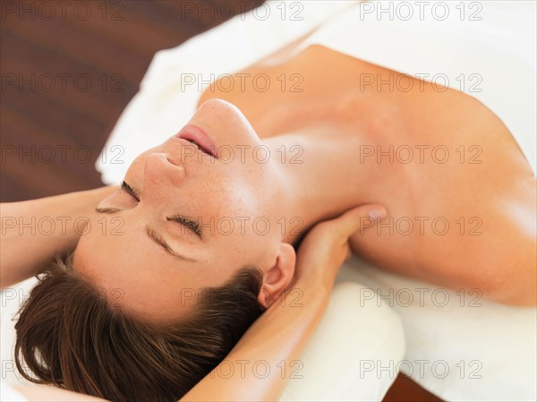 Woman receiving massage in spa