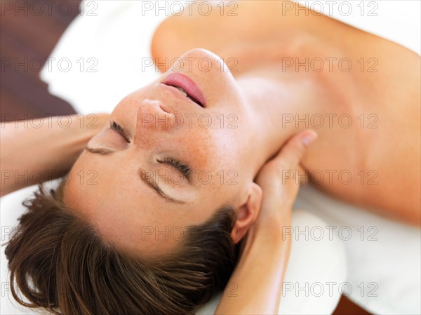 Woman receiving massage in spa