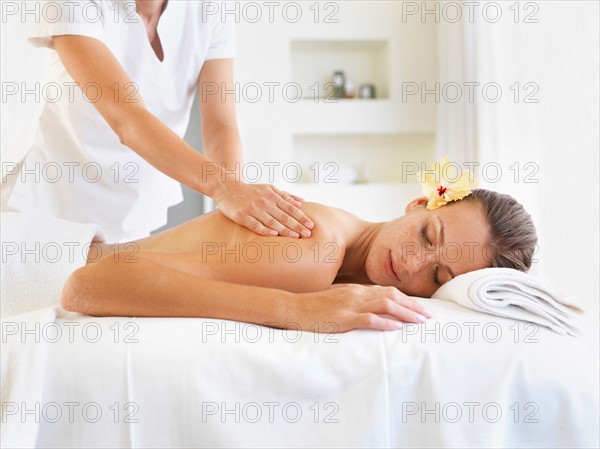 Woman receiving massage in spa