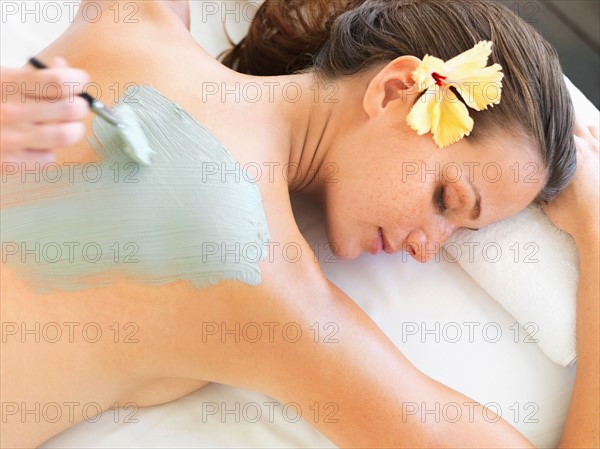 Woman receiving spa treatment