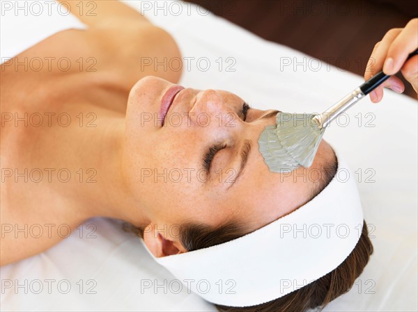 Woman receiving face spa therapy