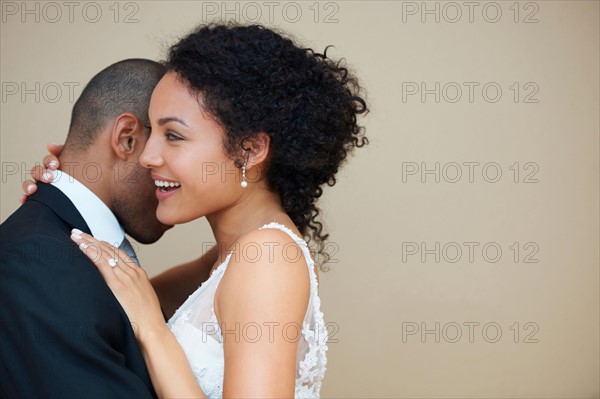 Bride and groom embracing