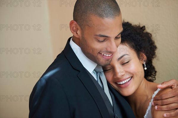 Bride and groom embracing