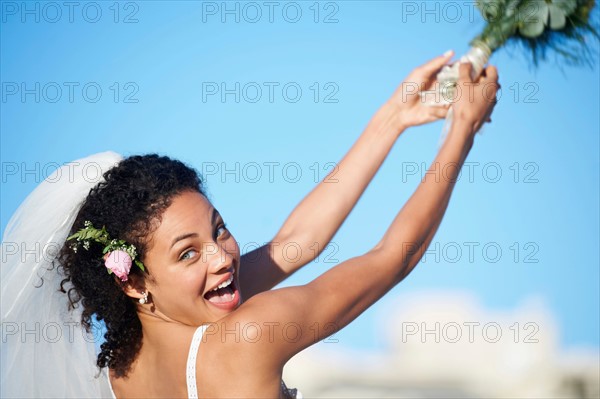 Bride throwing bouquet