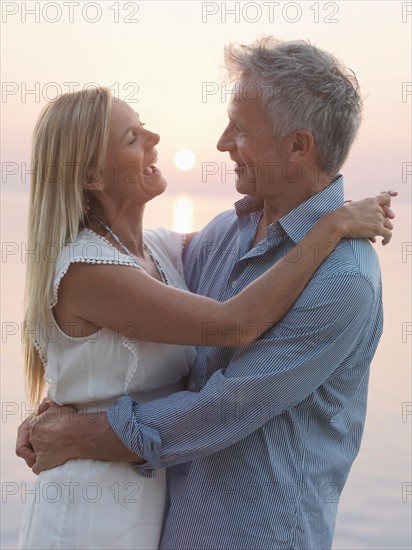 Portrait of mature couple at sunset