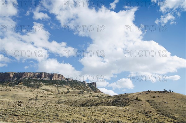 Clouds over barren landscape