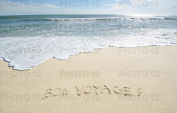 Bon Voyage' note on sand