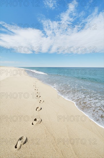 Footprints on sandy beach