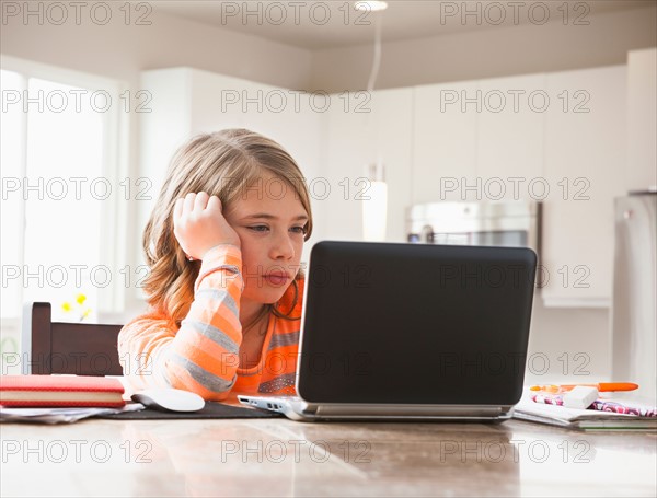 Girl (6-7) doing homework