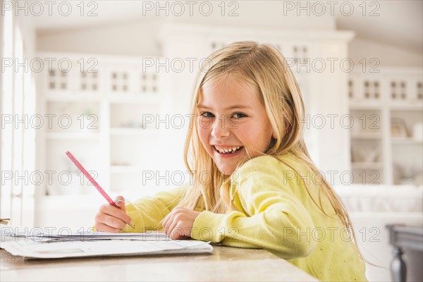 Girl (6-7) doing homework