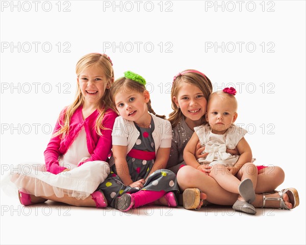 Portrait of four sisters (18-23 months, 2-3, 6-7)