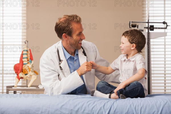 Pediatrician and boy (2-3)