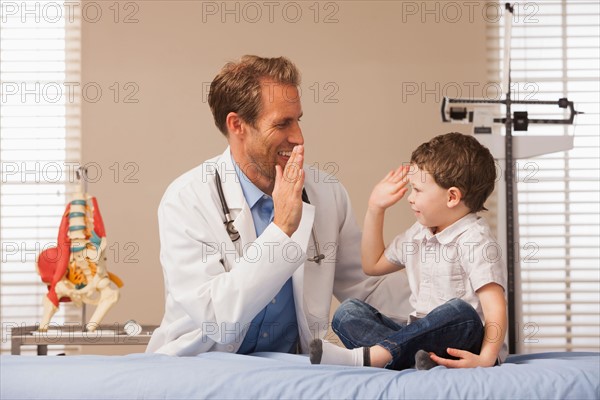 Pediatrician and boy (2-3)