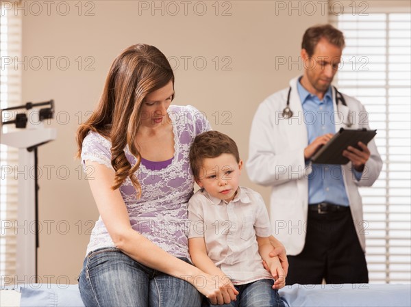 Mother with son (2-3) in doctor's office