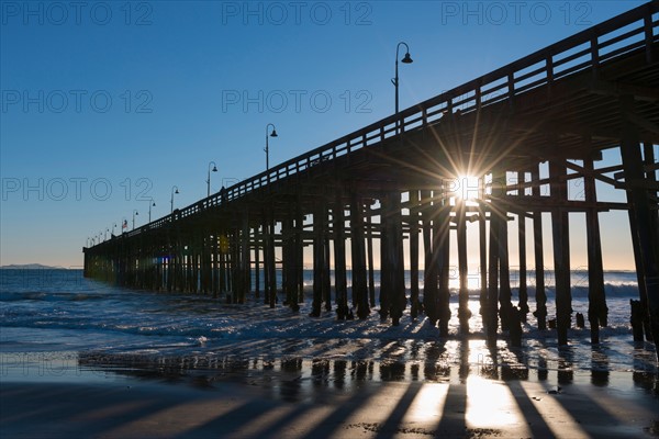 Sun shining through jetty