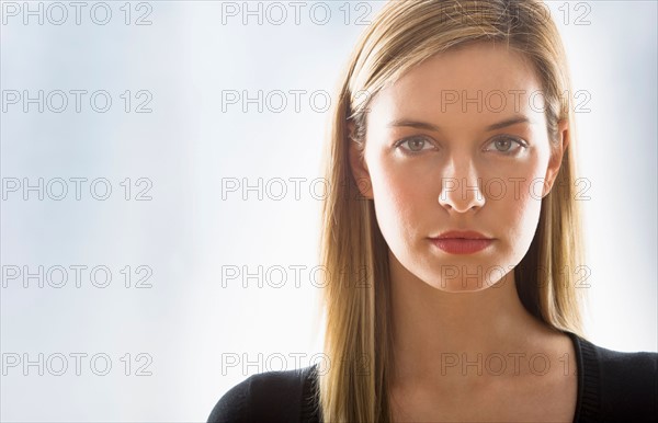 Studio portrait of young woman.