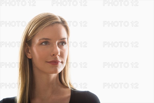 Studio portrait of young woman.