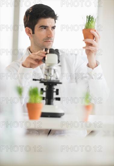 Scientist doing research on microscopes.