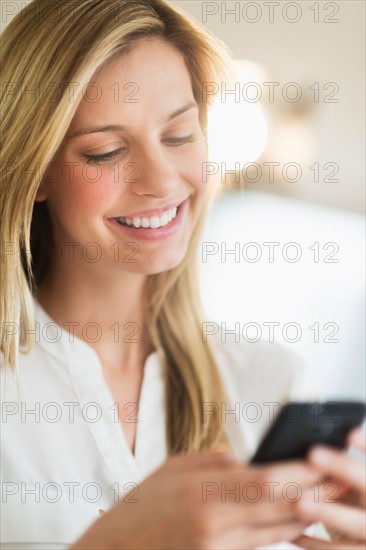 Woman texting on smartphone.
