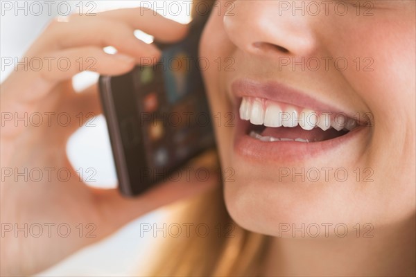 Close-up of woman talking on phone.