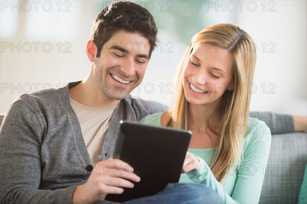 Couple using tablet pc.