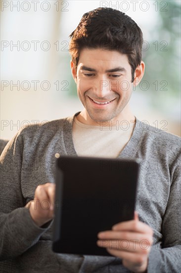 Man using tablet pc.