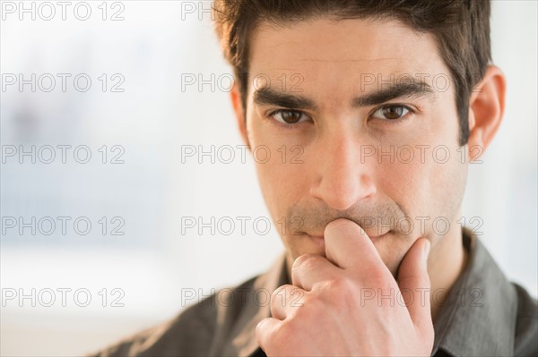 Studio portrait of mid adult man.