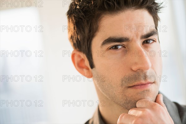 Studio portrait of mid adult man.