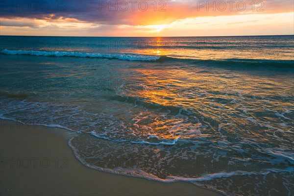 Sun setting over sea. Jamaica.