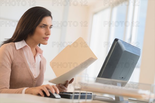 Businesswoman working on computer.