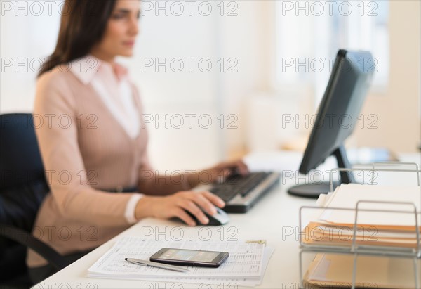 Businesswoman working on computer.