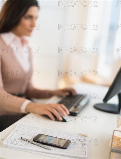 Businesswoman working on computer.