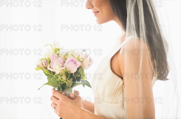 Bride holding bouquet.