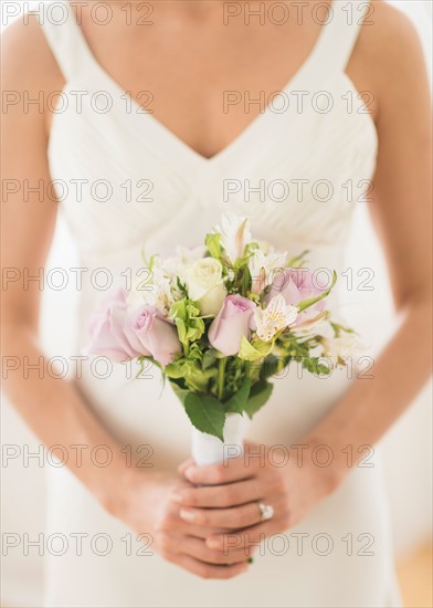 Bride holding bouquet.