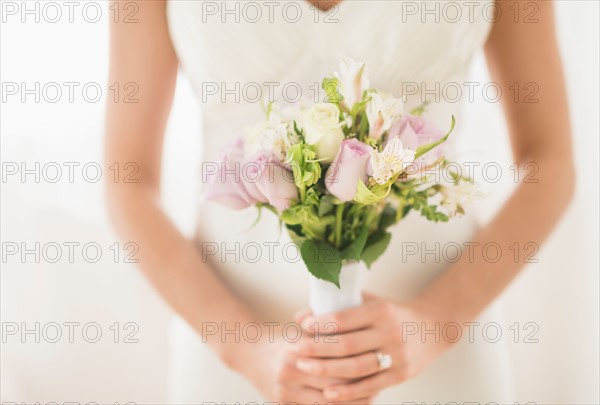 Bride holding bouquet.