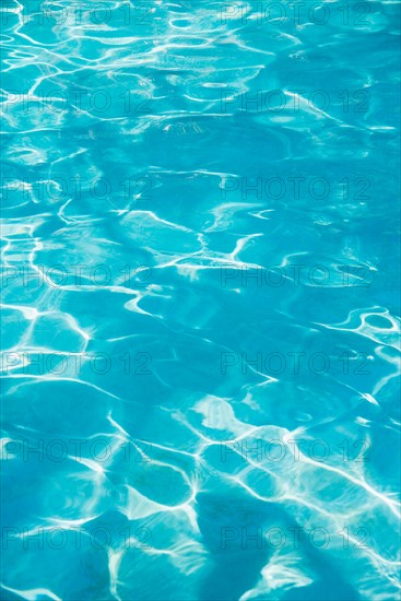 Water in swimming pool.