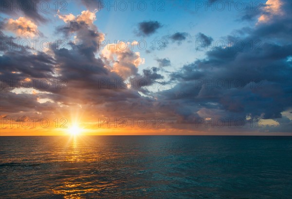 Sun setting over sea. Jamaica.