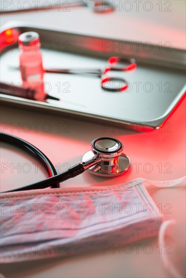 Close up of stethoscope and medication, studio shot.