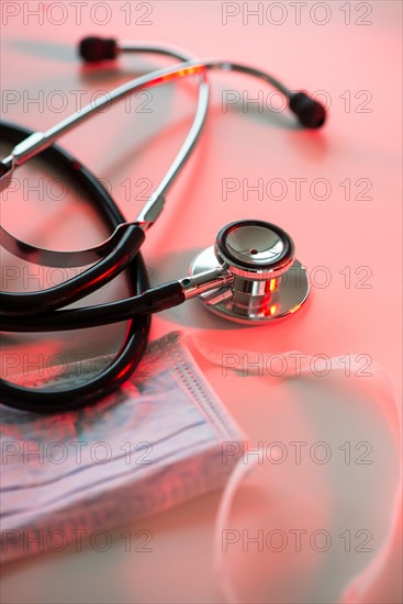 Close up of stethoscope and surgical mask, studio shot.