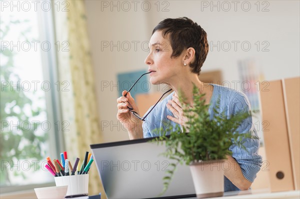 Woman working in home office.