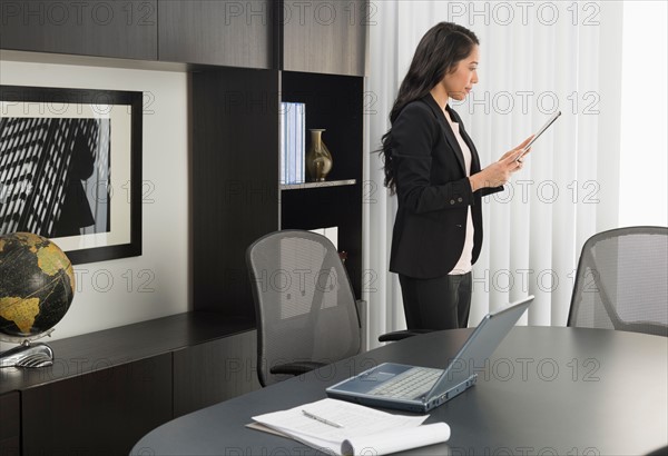 Businesswoman working in office.