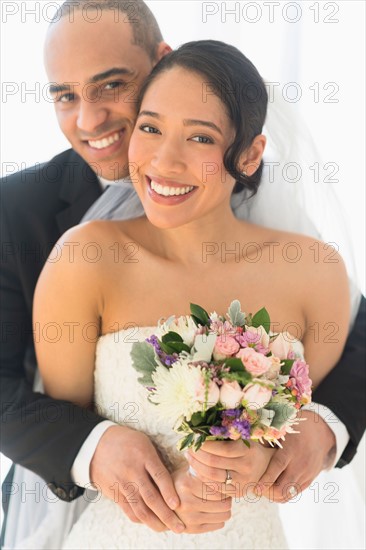 Portrait of happy newlywed couple.