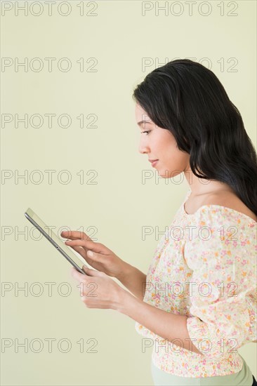 Young woman using digital tablet.