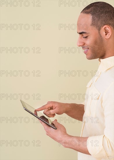Young man using digital tablet.