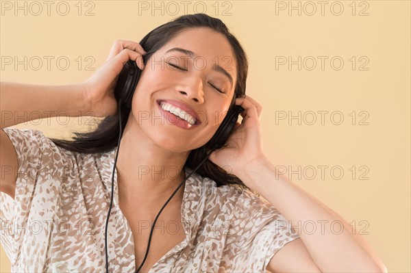 Young woman listening to music.