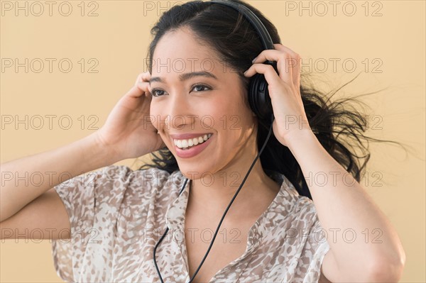 Portrait of young woman in headphones.