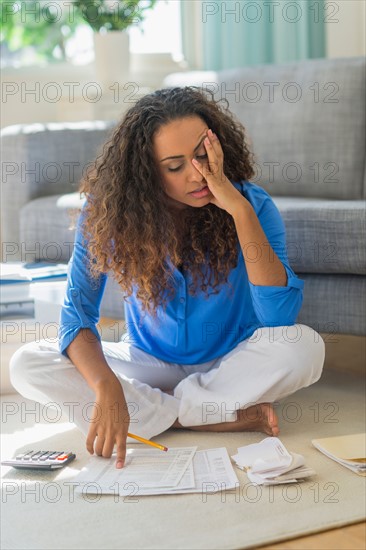 Young woman dealing with home finance.