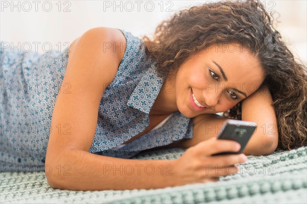Young woman using smartphone.